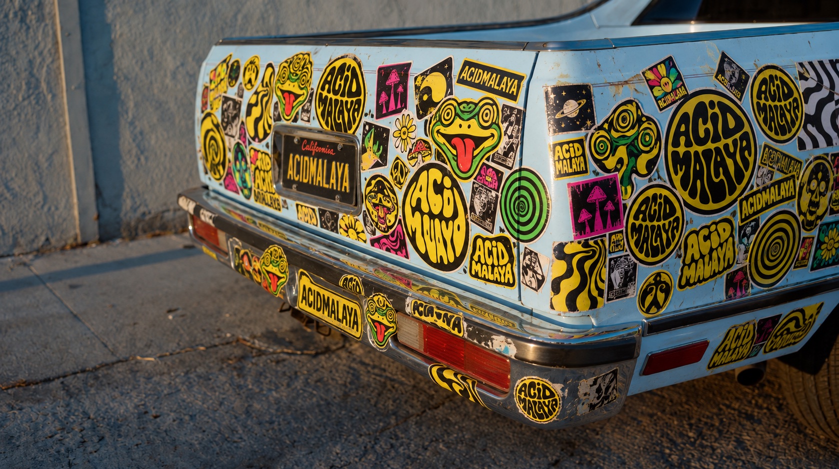 Vintage El Camino covered in Acid Malaya stickers