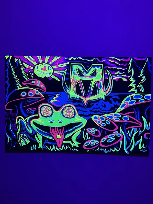 Frog and mushroom artwork glowing under blacklight