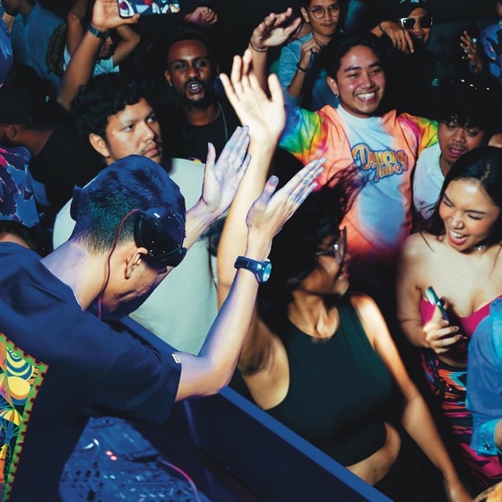 Packed dancefloor with people dancing